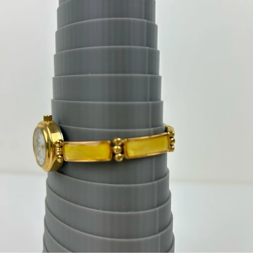Elegant Avon Gold Tone Watch with Yellow Accents, 1